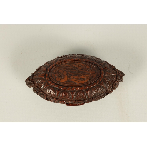 659 - A 19TH CENTURY CARVED CAQUILLA NUT SNUFF BOX of oval lidded form with finely carved scrolled leafwor... 