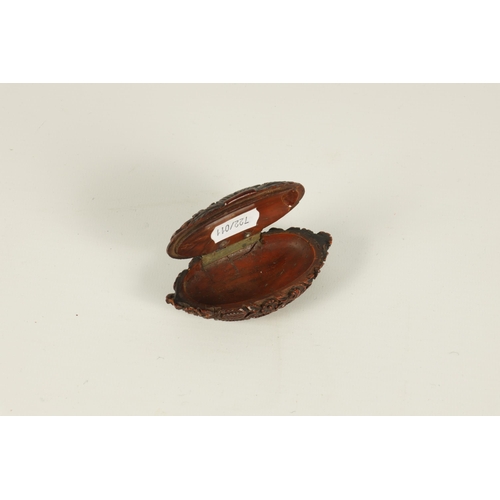 659 - A 19TH CENTURY CARVED CAQUILLA NUT SNUFF BOX of oval lidded form with finely carved scrolled leafwor... 