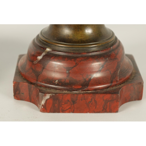 667 - E PROVOST A PAIR OF LATE 19TH CENTURY BRONZE TWO HANDLED FLATTENED OVOID VASES ON ROUGE MARBLE BASES... 