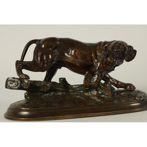 672 - A LATE 19TH CENTURY FRENCH PATINATED BRONZE SCULPTURE modelled as a dog on the scent standing on a n... 