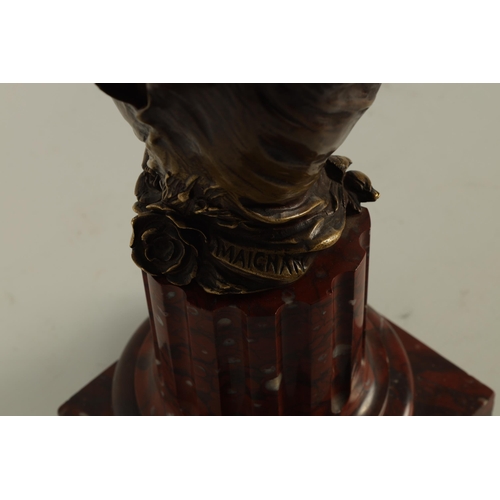 679 - MAURICE MAIGNAN. A FRENCH BRONZE AND ROUGE MARBLE BUST CIRCA 1900 modelled as a young woman mounted ... 