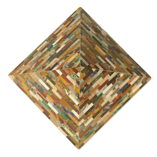 680 - A 19TH CENTURY STYLE COLOURED HARDSTONE PYRAMID modelled as layers of overlapping building blocks se... 