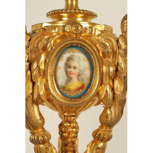 688 - A PAIR OF 19TH CENTURY FRENCH ORMOLU AND PORCELAIN PANELLED CANDLESTICKS the bodies inset with oval ... 