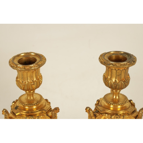 688 - A PAIR OF 19TH CENTURY FRENCH ORMOLU AND PORCELAIN PANELLED CANDLESTICKS the bodies inset with oval ... 