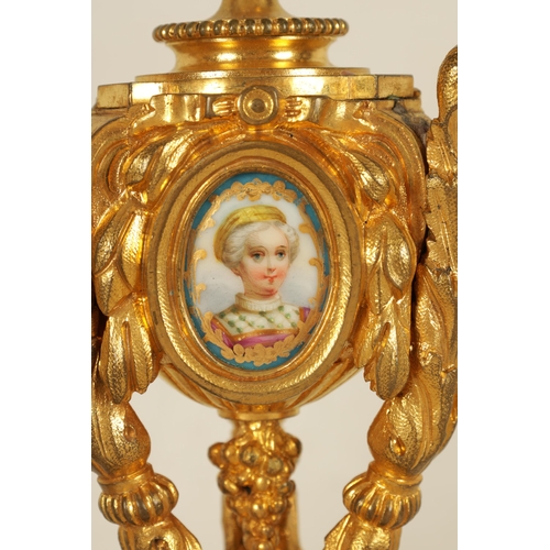 688 - A PAIR OF 19TH CENTURY FRENCH ORMOLU AND PORCELAIN PANELLED CANDLESTICKS the bodies inset with oval ... 