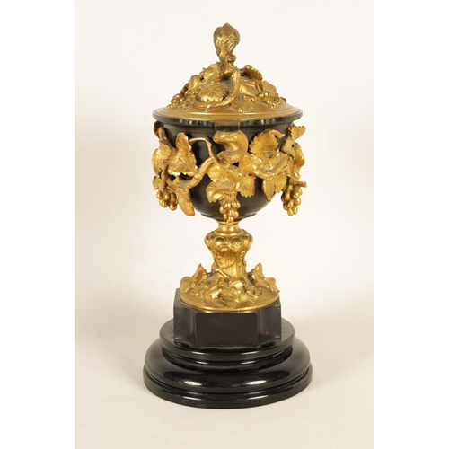 689 - A 19TH CENTURY FRENCH BRONZE AND ORMOLU VASE AND COVER the patinated bronze vase of campana form mou... 