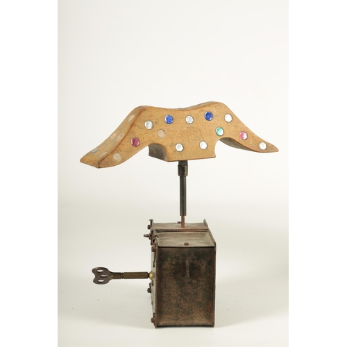 693 - AN 18TH CENTURY IRON WORK SPRING DRIVEN CLOCKWORK BIRD SCARER with revolving jewelled wood winged at... 