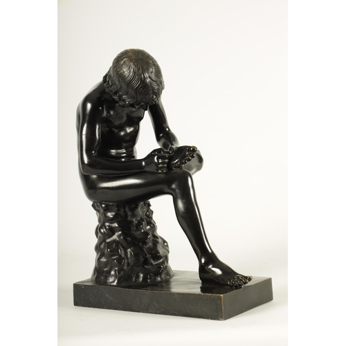 695 - A LATE 19TH CENTURY ITALIAN PATINATED BRONZE SCULPTURE modelled as a boy removing a thorn from his f... 