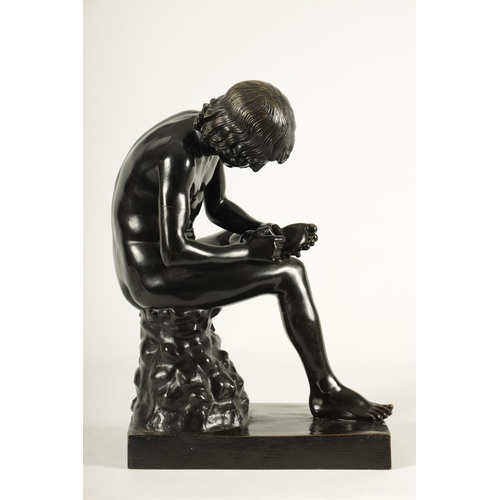 695 - A LATE 19TH CENTURY ITALIAN PATINATED BRONZE SCULPTURE modelled as a boy removing a thorn from his f... 