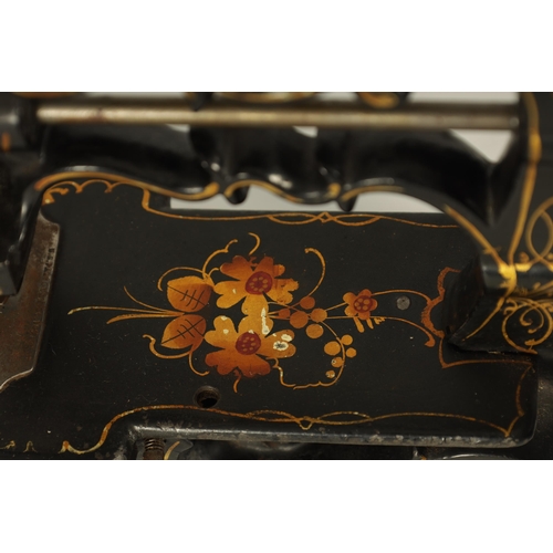 698 - CHARLES RAYMOND. A 19TH CENTURY PORTABLE CAST IRON SEWING MACHINE WITH ORIGINAL BOX painted black de... 