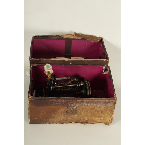 698 - CHARLES RAYMOND. A 19TH CENTURY PORTABLE CAST IRON SEWING MACHINE WITH ORIGINAL BOX painted black de... 