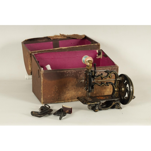 698 - CHARLES RAYMOND. A 19TH CENTURY PORTABLE CAST IRON SEWING MACHINE WITH ORIGINAL BOX painted black de... 