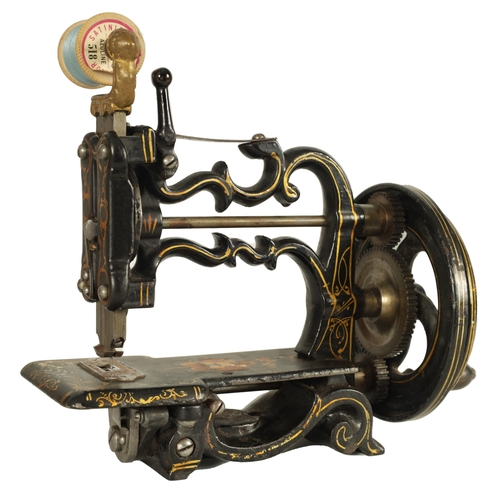 698 - CHARLES RAYMOND. A 19TH CENTURY PORTABLE CAST IRON SEWING MACHINE WITH ORIGINAL BOX painted black de... 