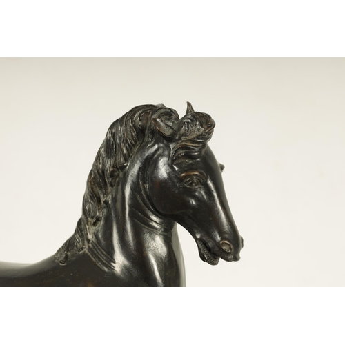 699 - AN 18TH/19TH CENTURY ITALIAN BRONZE SCULPTURE of a prancing horse, mounted on a veined marble moulde... 