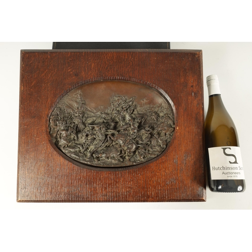 701 - AFTER JUSTIN MATHIEU. A 19TH CENTURY BRONZE OVAL PLAQUE MODELLED IN HIGH RELIEF DEPICTING A MEDIEVAL... 