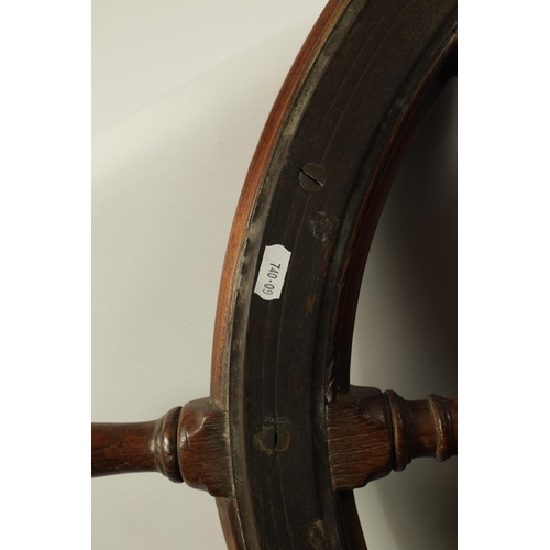 702 - A LATE 19TH CENTURY BRASS MOUNTED OAK SHIP'S WHEEL BY BROWN BOTHERS, EDINBURGH having eight turned s... 