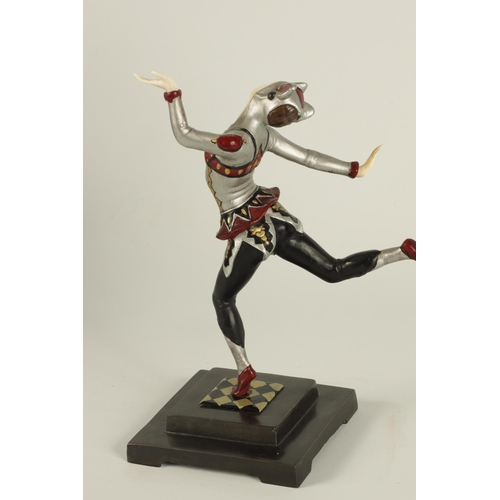 704 - AN ART DECO COLD PAINTED BRONZE AND IVORY FIGURE OF A FEMALE JESTER dancing and mounted on a stepped... 