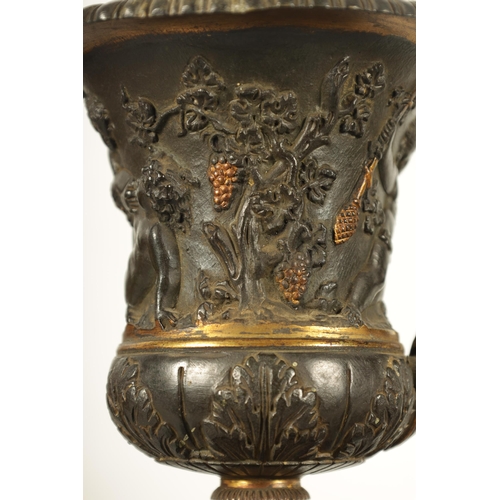 712 - A PAIR OF 19TH CENTURY FRENCH BRONZE AND ORMOLU URNS of classical campana form with gadrooned rims a... 