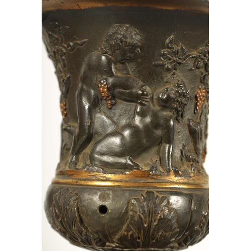 712 - A PAIR OF 19TH CENTURY FRENCH BRONZE AND ORMOLU URNS of classical campana form with gadrooned rims a... 