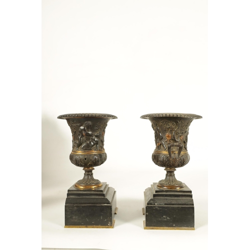 712 - A PAIR OF 19TH CENTURY FRENCH BRONZE AND ORMOLU URNS of classical campana form with gadrooned rims a... 