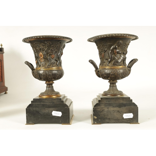 712 - A PAIR OF 19TH CENTURY FRENCH BRONZE AND ORMOLU URNS of classical campana form with gadrooned rims a... 