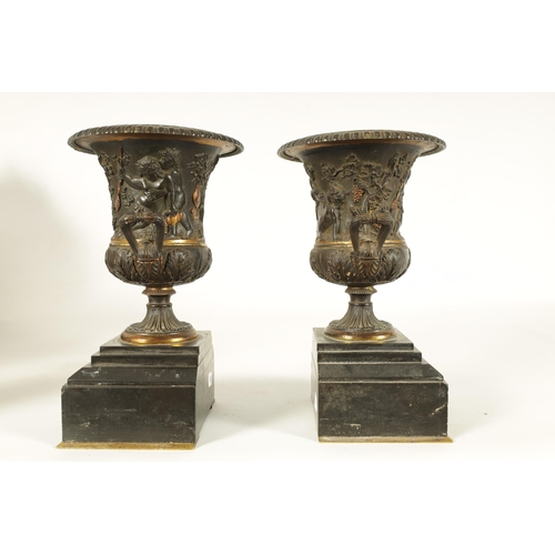 712 - A PAIR OF 19TH CENTURY FRENCH BRONZE AND ORMOLU URNS of classical campana form with gadrooned rims a... 