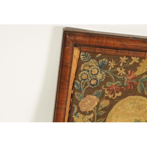 714 - A GEORGE II NEEDLEWORK TAPESTRY IN ORIGINAL FIGURED WALNUT SHORT GRAIN MOULDED FRAME depiciting clas... 