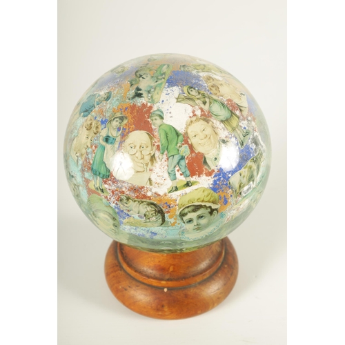 717 - A RARE 19TH CENTURY DECALCOMANIA GLASS GLOBE internally decorated with portraits, mask heads and dom... 