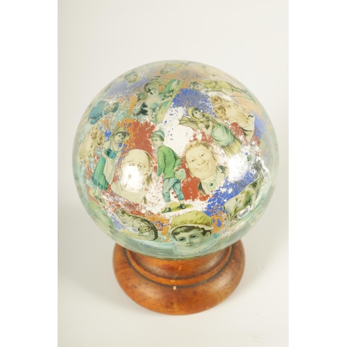 717 - A RARE 19TH CENTURY DECALCOMANIA GLASS GLOBE internally decorated with portraits, mask heads and dom... 