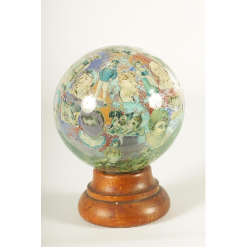 717 - A RARE 19TH CENTURY DECALCOMANIA GLASS GLOBE internally decorated with portraits, mask heads and dom... 