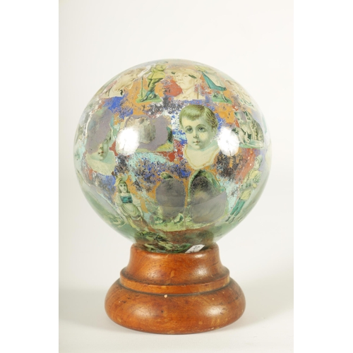 717 - A RARE 19TH CENTURY DECALCOMANIA GLASS GLOBE internally decorated with portraits, mask heads and dom... 