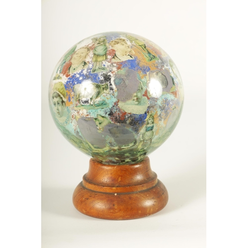 717 - A RARE 19TH CENTURY DECALCOMANIA GLASS GLOBE internally decorated with portraits, mask heads and dom... 