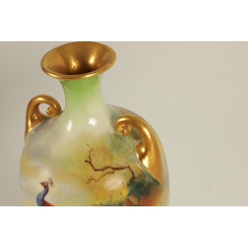 72 - AN EARLY 20TH CENTURY MINIATURE ROYAL WORCESTER DOUBLE HANDLED BALUSTER VASE painted with a scene of... 