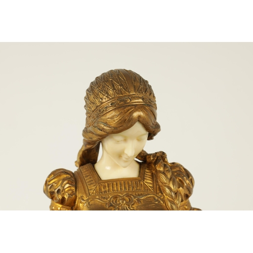 731 - A LATE 19TH CENTURY ART NOUVEAU GILT BRONZE AND IVORY FIGURE OF A SEATED YOUNG LADY depicted sat on ... 