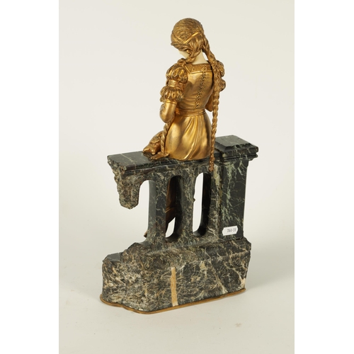 731 - A LATE 19TH CENTURY ART NOUVEAU GILT BRONZE AND IVORY FIGURE OF A SEATED YOUNG LADY depicted sat on ... 