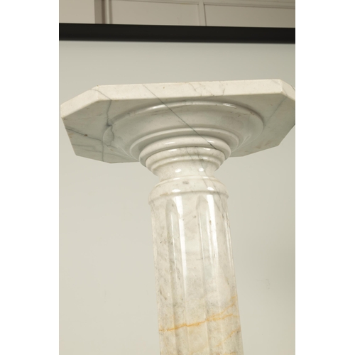 733 - AN EARLY 20TH CENTURY VEINED MARBLE REEDED COLUMN PEDESTAL on moulded base with canted cornered squa... 