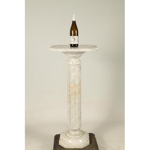 733 - AN EARLY 20TH CENTURY VEINED MARBLE REEDED COLUMN PEDESTAL on moulded base with canted cornered squa... 