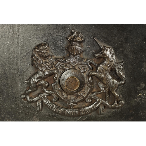 734 - A 19TH CENTURY CAST IRON STRONG BOX with riveted body and coat of arms to the front - in working con... 