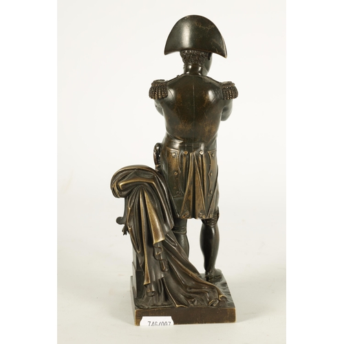 738 - A 19TH CENTURY BRONZE SCULPTURE OF NAPOLEON modelled standing by a draped pillar (23.5cm high)