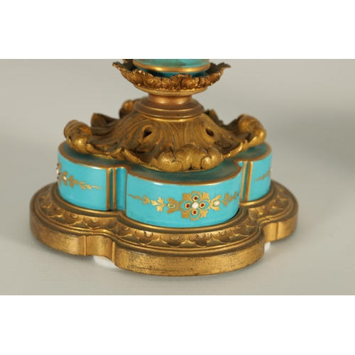 74 - A PAIR OF 19TH CENTURY FRENCH SEVRES STYLE ORMOLU MOUNTED VASES AND COVERS the slightly tapered jewe... 