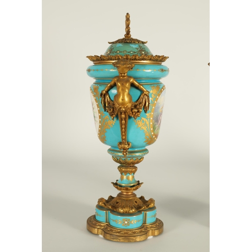 74 - A PAIR OF 19TH CENTURY FRENCH SEVRES STYLE ORMOLU MOUNTED VASES AND COVERS the slightly tapered jewe... 