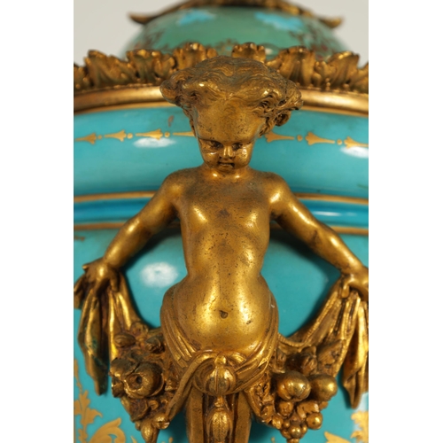 74 - A PAIR OF 19TH CENTURY FRENCH SEVRES STYLE ORMOLU MOUNTED VASES AND COVERS the slightly tapered jewe... 