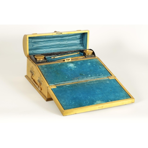 740 - A 19TH CENTURY GILT BRONZE WRITING SLOPE decorated with Tiger's Eye cabochons and embossed strap wor... 