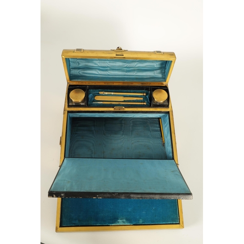 740 - A 19TH CENTURY GILT BRONZE WRITING SLOPE decorated with Tiger's Eye cabochons and embossed strap wor... 