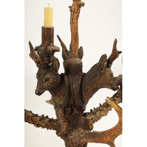 743 - AN UNUSUAL PAIR OF 19TH CENTURY BLACK FOREST POLYCHROME CARVED WOOD, ANTLER HORN AND BOAR'S TUSK FIV... 