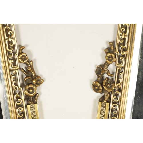 745 - A DECORATIVE PAIR OF LATE 19TH CENTURY GILT BRONZE FRENCH JAPANESE STYLE MIRRORS of rectangular form... 