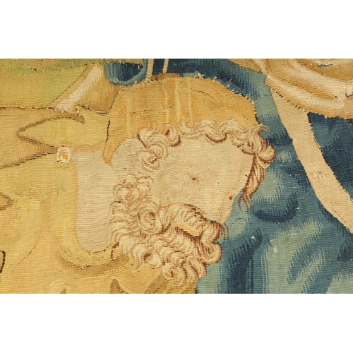 746 - A 17TH CENTURY WALL HANGING TAPESTRY worked with figures in a garden landscape setting; within a blu... 