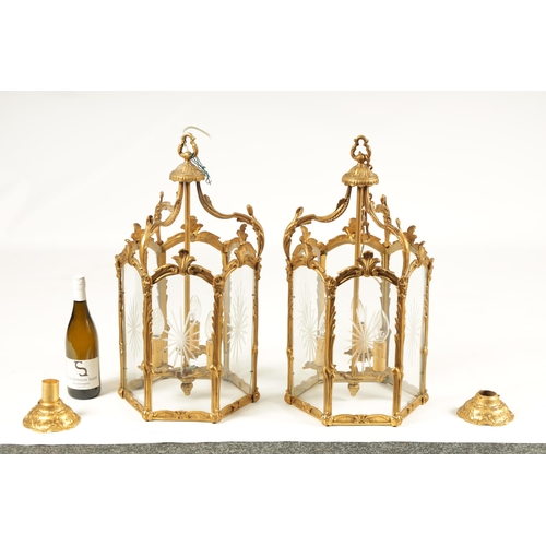 747 - A PAIR OF 19TH CENTURY GILT BRASS HANGING HALL LANTERNS with leaf cast branchwork hexagonal frames w... 