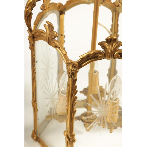 747 - A PAIR OF 19TH CENTURY GILT BRASS HANGING HALL LANTERNS with leaf cast branchwork hexagonal frames w... 