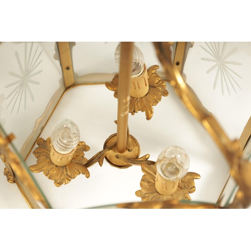 747 - A PAIR OF 19TH CENTURY GILT BRASS HANGING HALL LANTERNS with leaf cast branchwork hexagonal frames w... 